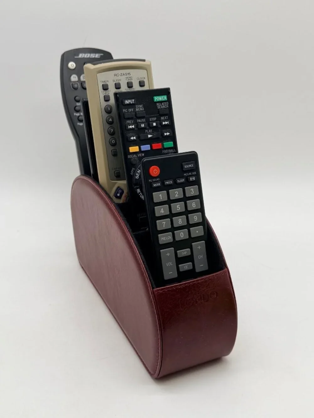 red Londo brand remote control holder features five compartments for organizatio